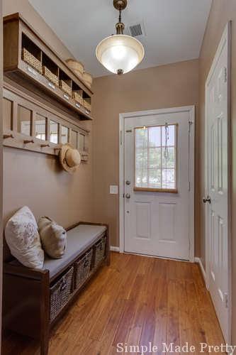 See how we updated our small entryway on a budget and check out the before and after pictures! Decorate A Small Entryway with Bench and Hooks, entryway door, entryway storage bench, storage benches, entryway ideas, entryway rugs, small entryway bench, entryway mirror, home entryway ideas, entryway table decor, entryway ideas with bench, entryway decor farmhouse, entryway decor with bench, entryway decor small entrance, entryway bench small decorating ideas #entrywaydecor 